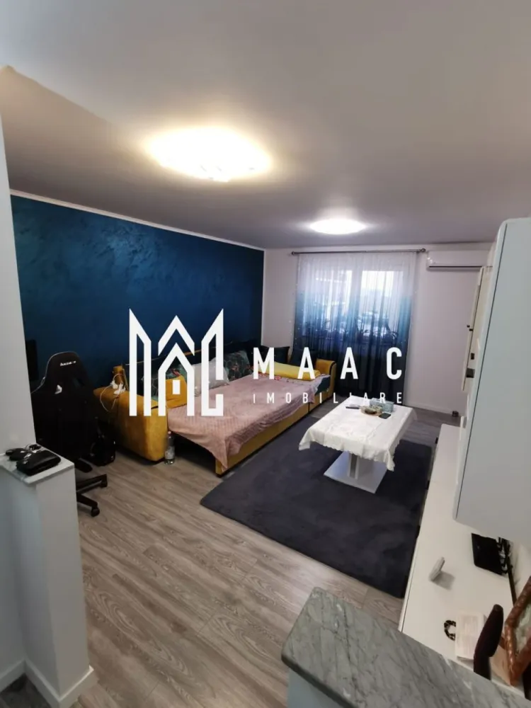 Apartament 3 camere | Etaj 1 | Decomandat | Arhitectilor - MAAC Imobiliare vă propune spre vânzare un apartament modern cu 3 camere, situat într-un imobil construit în anul 2017, amplasat în zona Cartierul Arhitecților. Imobilul are o suprafață utilă de 72 mp, la care se adaugă un balcon generos de aproximativ 12 mp, ideal pentru relaxare. Apartamentul este total decomandat, oferind intimitate și funcționalitate optimă, fiind compartimentat eficient pentru confortul întregii familii. Locuința se vinde complet mobilată și utilată, fiind gata pentru mutare imediată. Este situată la etajul 1 din 3, într-un bloc izolat termic exterior, ceea ce asigură un bun randament energetic și costuri reduse de întreținere. Un avantaj major al proprietății îl reprezintă cele două locuri de parcare înscrise în Cartea Funciară, incluse în preț. Această proprietate este ideală atât pentru locuit, cât și pentru investiție, datorită poziționării excelente și caracteristicilor premium. Pentru mai multe informații și programarea unei vizionări, vă invităm să contactați MAAC Imobiliare. ID: CP2841827. }}