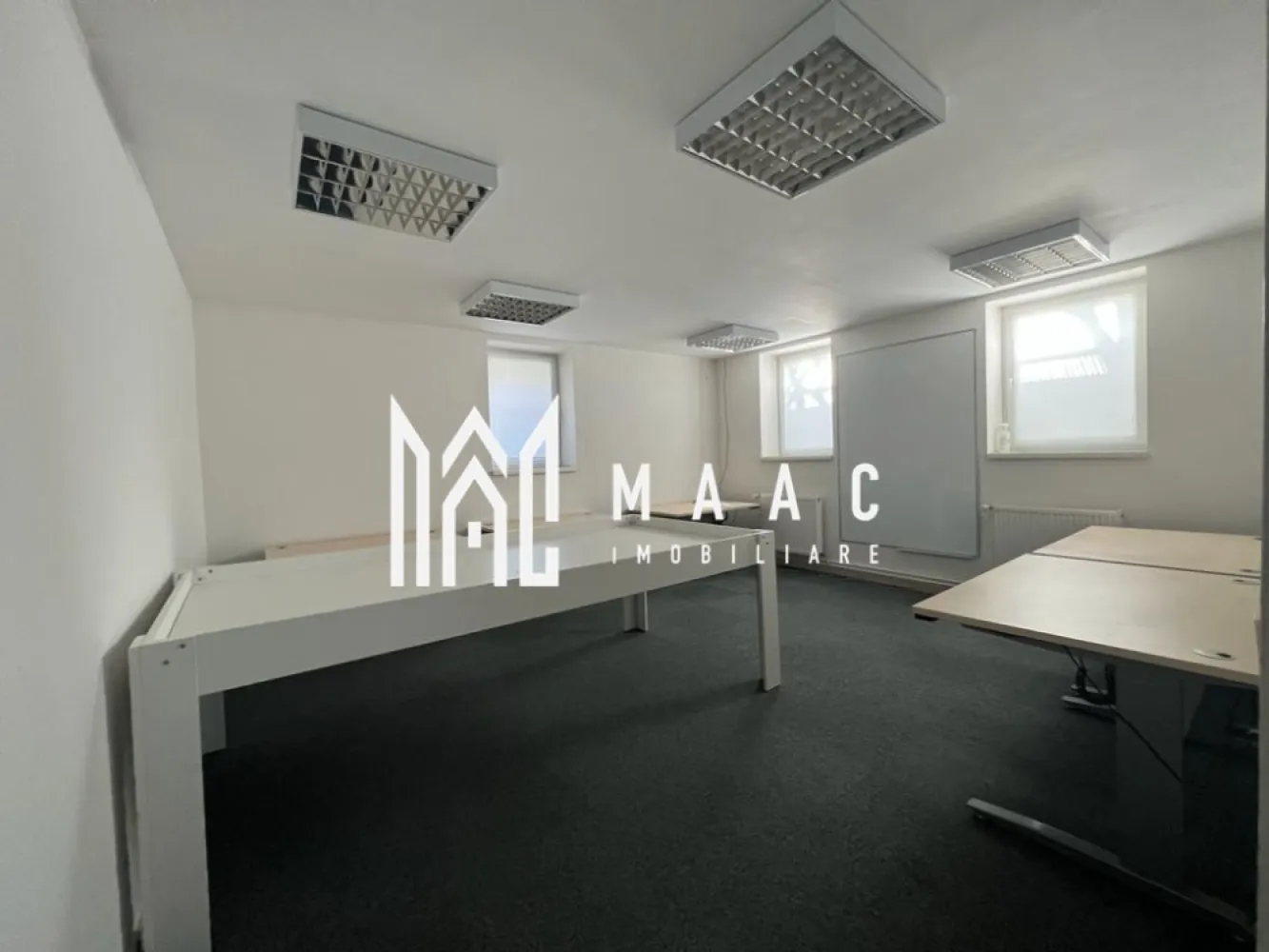 Cladire birouri I Parcare I Zona Sub Arini - MAAC IMOBILIARE propune atentiei dumneavoastra un imobil situat in proximitatea Parcului Sub Arini. Cu regim de inaltime D + P + M + P si clasa energetica A, proprietatea este folosita acum la activitati de birou si are o compartimentare eficienta: Demisol (92.27mp) -3 camere, 2 holuri, casa scarii, boxa, grup sanitar, camera tehnica Parter (101.28mp) - 4 incaperi spatioase, hol si casa scarii, 2 bai Mansardă (125.35mp) -open space, casa scarii cu hol, 2 bai, scara interioara pentru acces in podul de cca 50 mp. Terenul total - 470 mp, din care 320 mp curte libera in care sunt amenajate 6 locuri parcare (unul cu priza de incarcare masina electrica) si rasteluri pentru parcare de biciclete pentru 12 biciclete. Poarta pentru acces auto, automatizata; lift acces persoane cu dizabilitati; sistem supraveghere video; sistem control access; sisteme aer conditionat; usi interioare din aluminiu. Iluminatul interior este asigurat exclusiv cu corpuri de iluminat led; bransament curent trifazic + 25 kW. Sistem panouri fotovoltaice 21.75 kWp. Sistem Pompa de caldura si centrala termica Vissman integrate pentru incalzirea imobilului. Incalzitoare electrice pentru apa, la bai. Jaluzele montate in toate ramele ferestrelor. Dotari specifice activitatilor de birou-whiteboarduri generoase, montate pe peretii birourilor; ecran de proiectie retractabil, etc Se inchiriaza pe minim 12 luni. Pentru mai multe detalii precizati telefonic ca ati vazut anuntul cu ID:CP2818163 }}