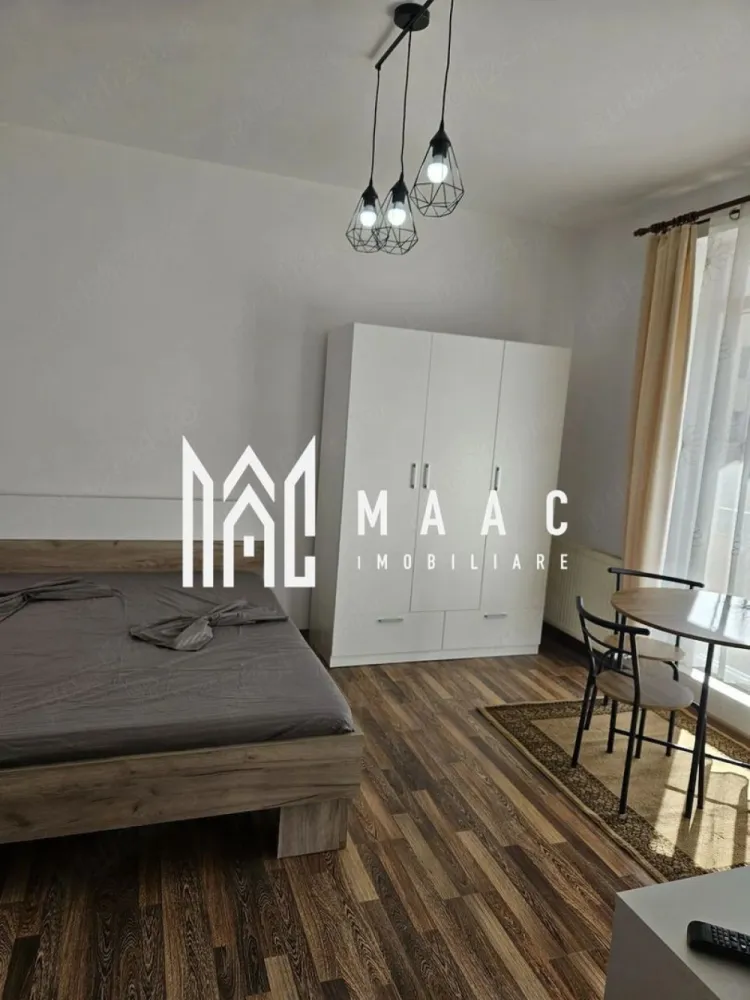 Garsonieră decomandată | Turnișor, Sibiu | etaj 2, balcon 7 mp - Garsonieră decomandată de închiriat în Sibiu, în zona Turnișor - Alma, cu 32 mp utili, balcon generos și amplasare la etajul 2, pregătită pentru mutare imediată.

Detalii proprietate:
• Suprafață utilă: 32 mp
• Suprafață construită: 38 mp
• Compartimentare: decomandată
• Etaj 2 din 4
• Balcon de 7 mp
• Imobil finalizat în 2011
• Stare interioară bună
• Se închiriază complet mobilată și utilată
• Mobilier nou, pregătită pentru primii chiriași
• Disponibilă imediat

Zonă și acces:
Proprietatea este situată în cartierul Turnișor, zona Alma din Sibiu, o locație apreciată pentru accesibilitate. Ai acces facil către stații de autobuz, magazine, centre comerciale și alte puncte de interes din oraș.

Dacă îți dorești o locuință gata de mutare, într-o zonă cu acces rapid către facilități urbane, contactează echipa MAAC Imobiliare pentru o vizionare. Cod anunț CP3199683.
