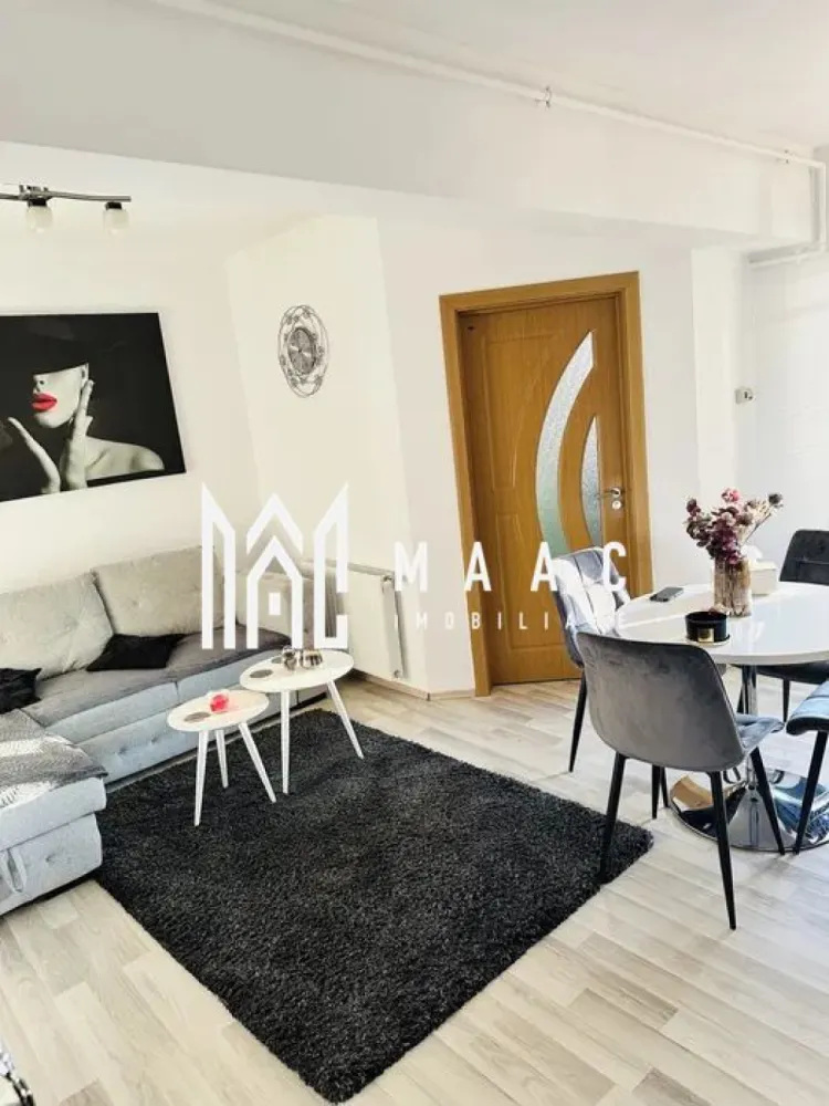 Apartament 2 camere I 50 MPU I Turnisor-Cartierul Alma - MAAC Imobiliare va propune spre vanzare un apartament spațios și luminos cu 2 camere, situat în cartierul Alma – Turnișor, la etajul 3 din 4 al unui imobil solid, bine întreținut. Apartamentul este decomandat și are o compartimentare practică, după cum urmează: living generos, bucătărie separată, dormitor, baie și balcon, oferind confort și funcționalitate. Locuința se vinde exact ca în poze, fiind complet mobilată și utilată cu electrocasnice moderne: frigider, aragaz, cuptor cu microunde și mașină de spălat. Apartamentul este într-o stare foarte bună, nu necesită reparații, fiind pregătit pentru mutare imediată – se predă la cheie. Zona Turnișor este liniștită și foarte căutată, cu acces facil la magazine, școli, grădiniță, creșă și mijloace de transport în comun, ceea ce face apartamentul extrem de practic pentru viața de zi cu zi. Este o alegere ideală pentru o familie, un cuplu sau pentru investiție, având un potențial foarte bun de închiriere. Pentru mai multe detalii si programarea unei vizionari va rugam sa specificati ID: CP2891672.
