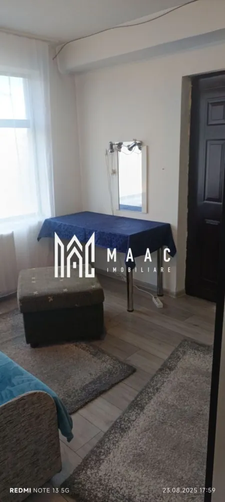 Apartament 2 camere la casa | Etaj 1 | Central - Piata Cluj - MAAC Imobiliare va propune spre inchiriere un apartament la casa, cu suprafata utila de 50 MP, format din living cu bucatarie open-space, dormitor, baie Apartamentul este dotat cu mobilier modern format din dulapuri haine , birou cu scaun ,1 TV,coltar extensibil in living, bucataria dotata cu mobilir modern,combina frigorifica,baie cu dus si masina de spalat rufe . In 10 minute se poate ajunge in Piata Cibin si in centrul Sibiului,magazine in aptropiere ,multe mijloace de transport in comun. Loc de parcare se gaseste usor in fata cladirii, sau in apropiere. Nu se accepta animale de companie in incinta. Se inchiriaza pe termen lung, minim 1 an si se percepe o garantie in cuantumul unei chirii lunare. Disponibilitate imediata. Pentru mai multe detalii precizati telefonic ca ati vazut anuntul cu ID: CP2975807 }}