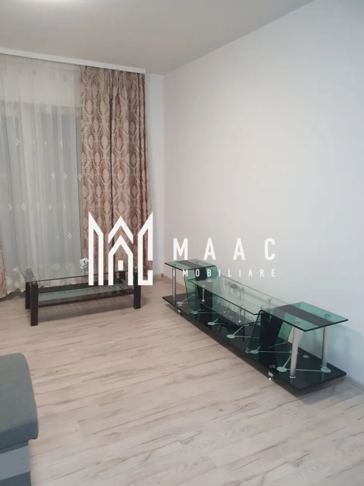 Apartament 2 camere | Etaj 1 | Balcon | Turnișor - MAAC Imobiliare vă propune spre închiriere un apartament cu 2 camere, situat în cartierul Turnișor, pe strada Eduard Albert Bieltz, într-o zonă liniștită și bine conectată, cu acces facil către punctele de interes ale orașului. Apartamentul este poziționat la etajul 1 al unui imobil cu regim de înălțime P+2 și beneficiază de o compartimentare eficientă, oferind un echilibru optim între funcționalitate și confort. Spațiile sunt bine organizate, iar lumina naturală contribuie la un ambient plăcut și primitor. Compartimentarea este următoarea: -2 camere -bucătărie separată -baie cu geam pentru aerisire naturală -balcon generos -cămară pentru depozitare Locuința este potrivită pentru un cuplu sau o persoană care își dorește confort, liniște și accesibilitate, fiind amplasată într-o zonă cu acces rapid către magazine, stații de transport în comun și alte facilități urbane. Condiții de închiriere: -preț chirie: 410 euro/lună, negociabil -garanție în cuantumul unei chirii -nu se acceptă animale de companie Pentru mai multe detalii sau pentru programarea unei vizionări, vă rugăm să menționați telefonic numărul CP2975556. }}