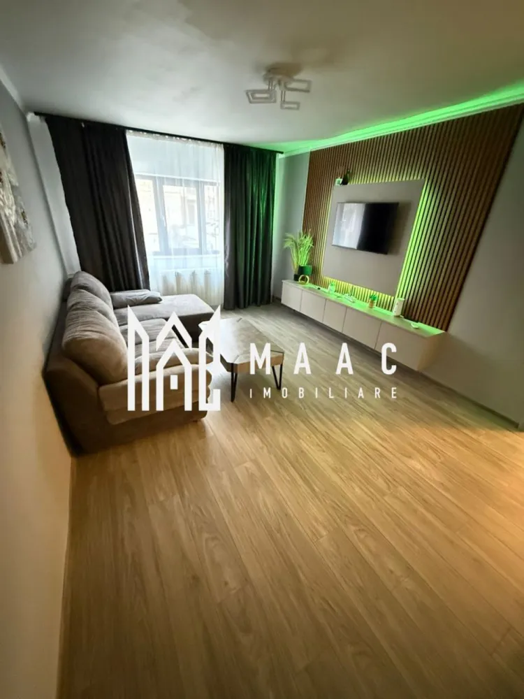 APARTAMENT 3 CAMERE RENOVAT| CENTRALA PROPRIE| ZONA PIATA OSTROVENI - MAAC Imobiliare vă propune spre închiriere un apartament spațios cu 3 camere, situat la parter, pe strada Ostroveni, într-o zonă liniștită și foarte bine conectată,in vecinatatea Bulevardului Dem Radulescu. Locuința are o suprafață generoasă de 80 mp și este compartimentată eficient în două dormitoare, living, bucătărie închisă, hol și multiple spații de depozitare, oferind confort și funcționalitate pentru întreaga familie. Apartamentul a fost recent renovat și este complet mobilat și utilat, fiind pregătit pentru mutare imediată. Facilități: ✔ Centrală termică proprie ✔ 2 aparate de aer condiționat ✔ Mașină de spălat vase ✔ Mobilier și electrocasnice complete Un mare avantaj îl reprezintă poziționarea excelentă: în imediata apropiere a Pieței Ostroveni, Școlii Nr. 9, precum și a numeroaselor magazine și farmacii, oferind acces rapid la toate facilitățile necesare vieții de zi cu zi. Datorită compartimentării și dotărilor, apartamentul oferă un nivel ridicat de confort pentru locuirea zilnică. Ideal pentru familie sau persoane care își doresc un spațiu generos, bine organizat și gata de utilizare. Pentru mai multe detalii și programarea unei vizionări, vă stăm la dispoziție! }}