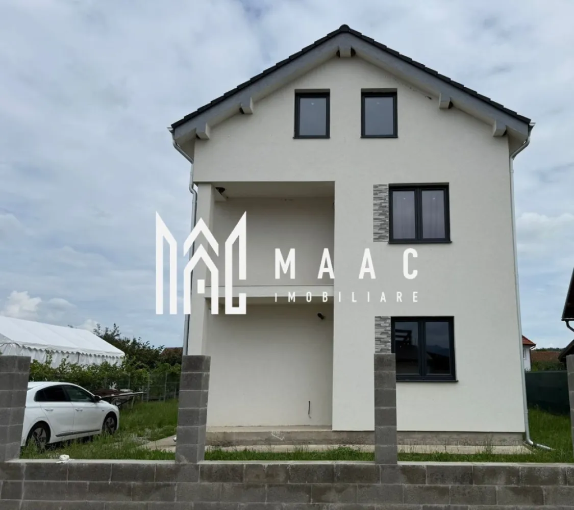 Casa 3 camere | Teren | 126 MPU | Cristian - Maac Imobiliare vă propune spre vânzare o casă individuală situată în comuna Cristian, într-o zonă liniștită, exclusiv de case, la doar câteva minute de centrul localității. Proprietatea se remarcă prin construcția solidă, compartimentarea practică, spațiile generoase și potențialul excelent de amenajare. Descrierea proprietății Casa are o suprafață utilă de 126 m², fiind amplasată pe un teren de 520 m², ideal pentru amenajarea unei grădini, a unui foișor, spațiu de relaxare sau loc de joacă pentru copii. Construcția este realizată pe structură de beton, cu placă turnată între etaje, ceea ce conferă stabilitate și durabilitate pe termen lung. În plus, proprietatea dispune de pod mansardabil de aproximativ 60 m², accesibil prin scară interioară din beton. Podul este pregătit pentru amenajare, având curent, apă și scurgere de WC deja trase – un avantaj important pentru extinderea spațiului locuibil. Compartimentare Parter: Hol generos la intrare Living luminos de 26 m², ideal pentru zona de zi Bucătărie separată, bine delimitată de restul casei Baie Spațiu de depozitare practic amplasat sub scară Etaj: 3 camere spațioase, dintre care una dispune de dressing și ieșire pe balcon, baie Acces către podul mansardabil cu o suprafata de 60 m². Spațiu generos, cu potențial pentru camere suplimentare Structură de beton armat Placă de beton între parter și etaj Tavan fals din gips-carton + vată minerală pentru o izolație suplimentară Ferestre premium cu 3 foi de sticlă, oferind eficiență energetică Izolație exterioară cu polistiren de 10 cm EPS80 Acoperiș solid, cu posibilitate de mansardare Proprietatea este racordată la curent, apă și canalizare. Nu dispune de gaze, însă încălzirea se realizează cu un termosemineu pe peleți, nou, neutilizat până în prezent — o soluție economică, modernă și foarte eficientă. Zona este foarte liniștită, cu vecini civilizați, ideală pentru cei care își doresc confortul unei comunități bine așezate, fără aglomerația orașului. Pentru mai multe detalii si programarea unei vizionari, va invitam sa contactati Maac Imobiliare specificand ID: CP2084453 }}