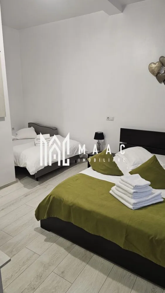 Casă cu 4 camere de vânzare | zona Ultracentrala - MAAC Imobiliare va propune spre vanzare o vilă tip hotelier, complet funcțională, situată ultracentral în Sibiu – una dintre cele mai căutate destinații turistice din România. Imobilul a fost construit în anul 2012 – un avantaj major și o raritate pentru zona centrală a Sibiului – și a fost complet renovat în 2018, oferind standarde moderne de confort și siguranță. Proprietatea este ideală pentru regim hotelier sau închiriere în scop turistic, având deja toate autorizațiile necesare și fiind pregătită pentru preluare imediată. Caracteristici principale: Suprafață utilă: aproximativ 90 mp 4 unități de cazare 4 dormitoare, fiecare cu baie proprie Compartimentare eficientă, optimizată pentru exploatare turistică Complet mobilată și utilată Avantaje investiționale: Certificare Ministerul Turismului – clasificare 3 stele Afacere la cheie – gata de preluat și exploatat imediat Locație ultracentrală, cu acces rapid la principalele atracții turistice Flux constant de turiști pe tot parcursul anului Randament excelent din închiriere în regim hotelier Imobilul se predă complet mobilat și utilat, fiind disponibil imediat pentru mutare sau pentru utilizare ca investiție într-o zonă centrală cu potențial ridicat. Această proprietate reprezintă o investiție sigură și profitabilă, fiind deja funcțională și poziționată într-o zonă premium. Ideală pentru investitori care doresc venituri imediate fără bătăi de cap. Locația este una deosebită atât din punct de vedere arhitectural, cât și al amplasamentului, fiind situată în centrul civic și cultural al orașului Sibiu, înconjurată de monumente istorice și culturale, teatre, muzee și zone cu ziduri de fortificație. Oportunitate rară de investiție! Pentru mai multe detalii, vă rugăm să menționați telefonic că ați văzut anunțul cu CP2984595. }}