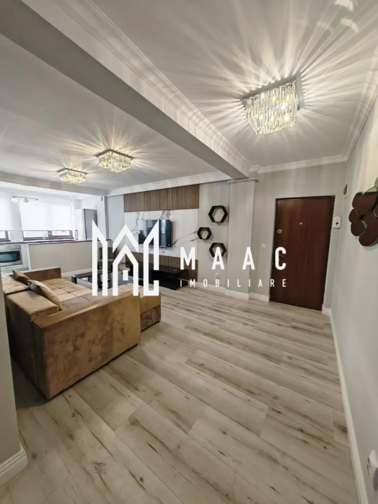 Apartament 2 camere | Etaj 3 | Parcare subterana | Central - Apartamentul are o suprafață utilă de 51 mp și este situat la etajul 3 al unei vile cu 3 etaje, construită în anul 2013. Locuința este complet renovată, cu mobilier și electrocasnice noi, fiind pregătită pentru mutare imediată. Compartimentarea este practică și modernă: living luminos cu bucătărie open space dormitor confortabil baie balcon închis și izolat termic Imobilul dispune de curte interioară închisă, cu poartă automată cu telecomandă, oferind siguranță și intimitate. Apartamentul beneficiază și de loc de parcare subteran. Se închiriază complet mobilat și utilat, fiind dotat cu: mașină de spălat haine mașină de spălat vase plită electrică cuptor cuptor cu microunde frigider centrală termică proprie TV Smart nou (140 cm) colțar și pat noi Condiții de închiriere: perioadă minimă contractuală: 12 luni garanție în cuantumul unei chirii se acceptă doar o singură persoană nu se acceptă animale de companie Pentru mai multe detalii sau pentru programarea unei vizionări, contactați echipa MAAC Imobiliare. ID: CP2987816. }}