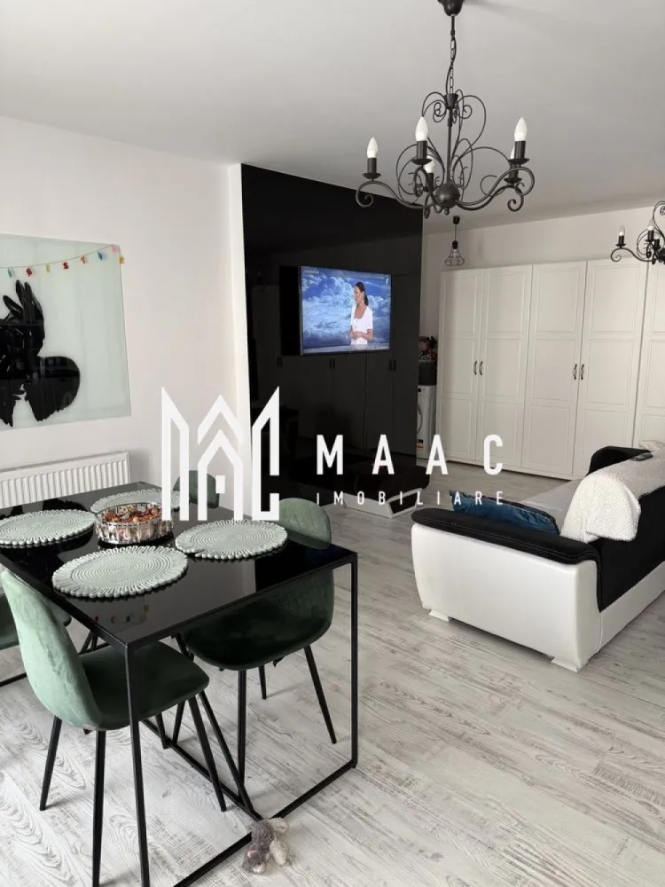Apartament 3 camere | Parcare | Decomandat | City Rezidence - MAAC Imobiliare vă propune spre vânzare un apartament spațios în City Residence, situat într-o zonă centrală a Sibiului, ideal atât pentru locuire personală, cât și pentru investiție. Proprietatea are o suprafață utilă de 64 mp și beneficiază de o terasă generoasă de 12 mp, un avantaj important pentru confortul zilnic. Apartamentul este amplasat la etajul 4 din 5, într-un imobil modern dotat cu lift. Locuința se vinde mobilată și utilată, fiind pregătită pentru mutare imediată sau pentru exploatare în regim de închiriere. Compartimentare practică Living open space cu bucătărie 2 dormitoare 2 băi Hol Terasă mare – 12 mp, ideală pentru zonă de relaxare Avantaje Ansamblu rezidențial modern – City Residence Zonă centrală, cu acces rapid către punctele de interes Apartament luminos și bine compartimentat Lift în imobil Terasă spațioasă, greu de găsit la această categorie Potrivit pentru locuit sau investiție cu randament bun Localizare: City Residence, Sibiu Pentru mai multe detalii și programarea unei vizionări, vă rugăm să ne contactați menționând ID: CP2945687. }}