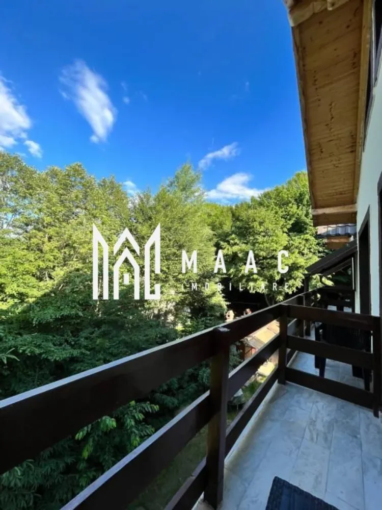 Pensiune Turistica | 360MPU | Porumbacu de Sus - MAAC Imobiliare vă propune spre vânzare o pensiune / casă de vacanță complet funcțională, situată în Porumbacu de Sus, una dintre cele mai apreciate zone turistice din județul Sibiu. Cu o activitate solidă de peste 4 ani și un flux constant de turiști, proprietatea reprezintă o afacere matură, stabilă și pregătită pentru preluare imediată. Construită în 2021 și menținută impecabil, pensiunea oferă 360 mp utili, inteligent compartimentați pentru confort și funcționalitate. Clădirea principală este dispusă pe parter, etaj și pod mansardat, beneficiind de 5 unități de cazare, fiecare cu baie proprie și balcon -un apartament, o cameră triplă și trei camere duble. Spațiile sunt luminoase, curate și gândite pentru a răspunde nevoilor fiecărui oaspete. La acestea se adaugă un living generos, o bucătărie complet utilată, șase dormitoare, șase băi. Regasim și o terasă de aproximativ 20 mp — locul ideal pentru relaxare și socializare. În exterior este amenajată și o bucătărie de vară cu foișor și zonă de barbecue, spațiu preferat de turiști în sezonul cald. Din punct de vedere tehnic, proprietatea dispune de încălzire centrală pe peleți, izolație exterioară de 10 cm, acoperiș Bilka, alimentare cu apă de la rețea plus fântână proprie, contor trifazic Totul este pregătit pentru continuarea activității turistice fără investiții imediate. Proprietatea se află pe un teren de 1.000 mp, dintre care aproximativ 900 mp reprezintă curte liberă — un spațiu generos, ideal pentru amenajarea unor facilități suplimentare precum saună, ciubăr, zone de relaxare sau noi unități de cazare. Pe lângă clădirea principală, în partea din spate a terenului se află o cabană secundară din lemn, de aproximativ 50 mp, P+M, locuibilă, care necesită renovare, dar oferă un potențial foarte bun pentru extinderea capacității sau pentru proiecte independente de cazare. Curtea dispune de 6–7 locuri de parcare, acces facil și un cadru natural liniștit, apreciat de turiști pe tot parcursul anului. Datorită apropierii de Transfăgărășan, Castelul de Lut Valea Zânelor, Sibiu și numeroase trasee montane, vizibilitatea și cererea sunt constante. Recomandată pentru investitori în turism, familii ce caută o afacere în exploatare sau proiecte de extindere tip mini-complex turistic, această proprietate oferă siguranță, potențial și un cadru natural deosebit. Pentru mai multe detalii și programarea unei vizionări, contactați agenția MAAC Imobiliare și specificați ID-ul anunțului: CP2819284. }}