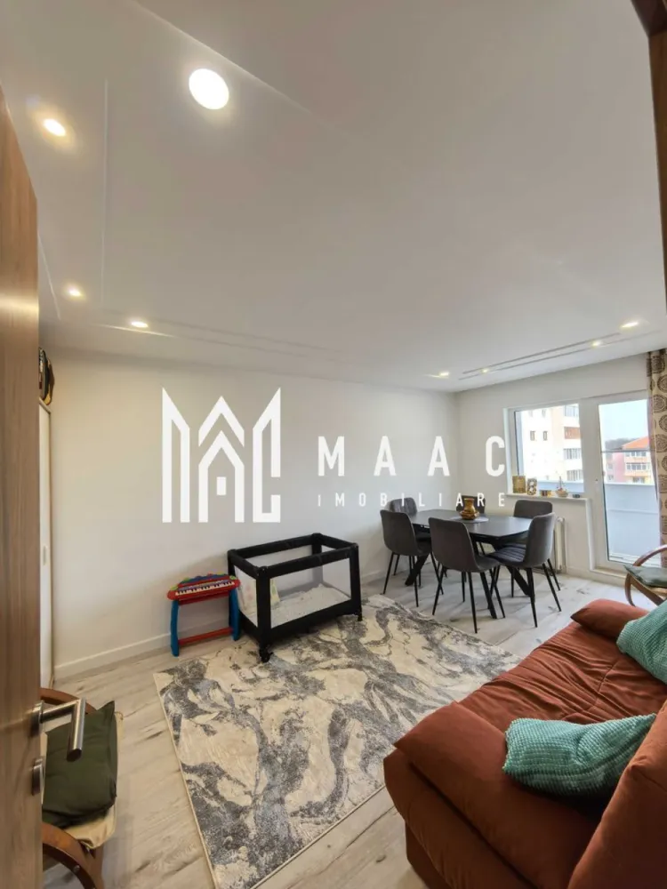 Apartament 4 Camere | 105MPU | Renovat | Valea Aurie - MAAC Imobiliare vă propune spre vânzare un apartament cu 4 camere, decomandat, situat într-o zonă foarte bine cotată din Sibiu, aproape de parcuri și facilități. Apartamentul are o suprafață utilă de 105 mp, este recent renovat și se remarcă printr-o compartimentare practică și spații generoase, fiind potrivit pentru o familie. Compartimentare Living luminos 3 dormitoare Bucătărie separată Hol Baie 2 balcoane (unul închis, unul deschis) Dotări și îmbunătățiri Instalații sanitare, electrice și de gaz schimbate Finisaje în stare foarte bună Acoperiș izolat Apartament bine întreținut Alte beneficii Pivniță pentru depozitare Zonă cu acces rapid către parcuri, magazine, școli și transport public Aproape de Parcul Sub Arini și Pădurea Dumbrava Apartamentul este o alegere potrivită pentru locuit, datorită spațiului și poziției. Pentru mai multe detalii și programarea unei vizionări, vă rugăm să ne contactați menționând ID: CP2995739 }}