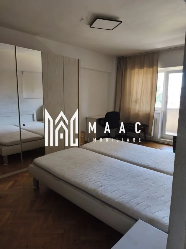 Apartament 2 camere | 70 mpu | Balcon | Mihai Viteazu - Apartament decomandat cu 2 camere de închiriat pe Mihai Viteazu, Sibiu

MAAC Imobiliare propune spre închiriere un apartament decomandat cu 2 camere, situat pe Bulevardul Mihai Viteazu din Sibiu, una dintre cele mai căutate și bine conectate zone ale orașului.

Apartamentul este amplasat la etajul 1 și are o suprafață utilă de 70 mp, oferind un spațiu generos, bine compartimentat și potrivit pentru locuire imediată. Proprietatea se închiriază complet mobilată și utilată.

Compartimentarea este practică și include 2 camere, bucătărie, baie și balcon.

Locuința beneficiază de balcon, mobilier și dotări necesare pentru confortul zilnic, fiind disponibilă pentru mutare imediată.

Zona oferă acces rapid către magazine, supermarketuri, centre comerciale, școli, farmacii, mijloace de transport și alte puncte de interes din Sibiu.

Pentru mai multe detalii sau pentru stabilirea unei vizionări, contactați echipa MAAC Imobiliare.

ID anunț: CP3216310