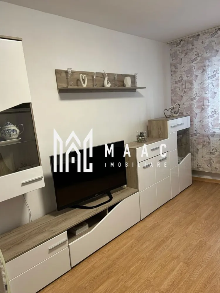 Apartamente de închiriat Sibiu | Terezian | 2 camere, 2 balcoane - Apartamente de închiriat Sibiu: locuința aceasta cu 2 camere din Terezian oferă 50 mp utili, două balcoane și bucătărie închisă, fiind o opțiune practică pentru locuire pe termen lung.

Detalii proprietate:
• Suprafață utilă: 50 mp
• Suprafață construită: 64 mp
• 2 camere, 1 dormitor, 1 baie, 1 bucătărie
• Două balcoane
• Stare interioară: bună
• An construcție: 1980
• Bucătărie închisă, complet mobilată și utilată
• Compartimentarea din descriere include living, dormitor, baie, hol și două balcoane

Zona Terezian oferă acces rapid către centrul orașului și către zonele comerciale importante. În apropiere se regăsesc școli, grădinițe, magazine, supermarketuri, farmacii și stații pentru transportul în comun, utile pentru un stil de viață comod în Sibiu.

Pentru detalii suplimentare și programarea unei vizionări, contactați echipa MAAC Imobiliare și menționați Cod anunț CP3214154.

Conținut optimizat cu AI, aprobat de agent uman.