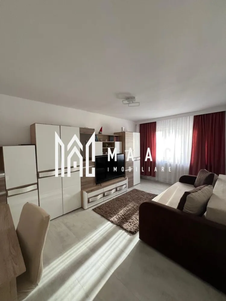Apartament 3 camere | Lift | 70MPU | Vasile Aron - MAAC Imobiliare vă propune spre închiriere / vânzare un apartament decomandat cu 3 camere, situat la etajul 5 al unui imobil dotat cu lift, ideal pentru cei care își doresc un spațiu bine compartimentat, luminos și ușor de personalizat după propriul stil. Locuința are o suprafață utilă de 70 mp și se află într-un bloc construit în perioada 1990–2000, beneficiind de o compartimentare practică și de un interior modern. Compartimentare: Living generos Doua dormitoare nemobilate Bucătărie mobilată și utilată Baie Debară Avantaje: Decomandat 3 camere 70 mp utili Bloc cu lift Bloc construit în perioada 1990–2000 Interior modern Bucătărie complet mobilată și utilată 2 dormitoare nemobilate – ideale pentru personalizare Pentru mai multe detalii sau programarea unei vizionări, nu ezitați să ne contactați specificand ID: CP3008998 }}