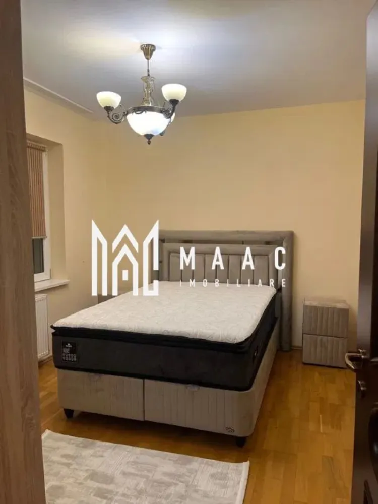 Apartament 3 camere | 98 MPU | Parcare | Zona Ștrand - MAAC Imobiliare vă propune spre închiriere un apartament modern și bine compartimentat, cu 3 camere, situat la parter înalt, în zona Ștrand – Sibiu. Proprietatea oferă o suprafață generoasă și o compartimentare practică, formată din living, două dormitoare, birou, bucătărie complet mobilată și utilată, două băi și un balcon spațios. Apartamentul se închiriază complet mobilat și utilat, fiind pregătit pentru ocupare imediată. Beneficiază de loc de parcare inclus în preț, acces facil către principalele artere ale orașului, precum și de proximitatea față de magazine, școli și transport public. Nu se acceptă animale de companie. Se percepe garanție în valoarea unei chirii. Prețul este negociabil. Pentru mai multe detalii sau pentru a programa o vizionare, vă rugăm să ne contactați. Specificați ID-ul CP2810697. }}
