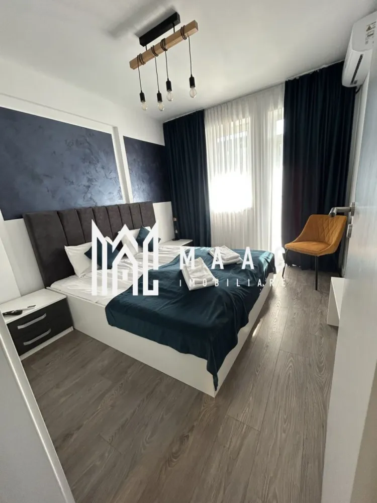 Apartamente 2 Camere | 40Mp | Balcon | Loc de Parcare | Cartierul Henri Coandă - MAAC Imobiliare vă propune spre vânzare un apartament modern cu 2 camere, situat în cartierul Henri Coandă din Sibiu, într-o zonă rezidențială aflată în plină dezvoltare, apreciată pentru liniște, acces facil către oraș și comunitatea rezidențială în continuă formare. Proprietatea reprezintă o alegere potrivită atât pentru locuință personală, cât și pentru investiție imobiliară, datorită poziționării într-un cartier modern și a nivelului ridicat de amenajare. Apartamentul este amenajat la standarde premium și se vinde complet mobilat și utilat, fiind pregătit pentru mutare imediată sau pentru introducerea rapidă în circuitul de închiriere. Spațiul interior este gândit pentru confort și funcționalitate, cu finisaje moderne, mobilier de calitate superioară și un ambient elegant care oferă un spațiu luminos și primitor. Dotări și beneficii: -încălzire în pardoseală -aer condiționat -bucătărie complet utilată (plită electrică, frigider și electrocasnice) -televizoare în fiecare cameră -mobilier modern de calitate superioară -loc de parcare inclus Interiorul apartamentului este amenajat într-un stil modern și elegant, cu atenție la detalii și materiale de calitate, oferind un nivel ridicat de confort pentru viitorii proprietari. Compartimentarea și dotările îl fac potrivit atât pentru utilizare imediată, cât și pentru exploatarea eficientă ca investiție. Proprietatea este potrivită pentru: -închiriere pe termen lung -regim hotelier -locuință personală Datorită poziției în cartierul Henri Coandă, una dintre zonele rezidențiale aflate în dezvoltare din Sibiu, apartamentul reprezintă o oportunitate atractivă pentru cumpărătorii care caută o locuință modernă sau o investiție sigură pe piața imobiliară locală. Bonus: primele apartamente vândute vor beneficia de spațiu de depozitare la subsol, ideal pentru depozitarea obiectelor personale sau sezoniere. Proprietățile bine amenajate din această zonă se vând rapid, motiv pentru care recomandăm programarea unei vizionări din timp pentru a descoperi avantajele acestei proprietăți. Pentru mai multe informații și programări la vizionare, vă rugăm să ne contactați telefonic și să menționați CP2955537. }}