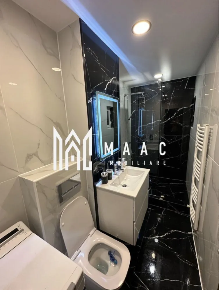 Apartament 2 camere | 55 MPU | Vasile Milea - MAAC Imobiliare vă propune spre închiriere un apartament cu 2 camere situat ultracentral, pe Bulevardul Vasile Milea din Sibiu, într-o zonă extrem de accesibilă și bine conectată la principalele puncte de interes ale orașului. Poziționarea reprezintă unul dintre principalele avantaje ale acestei proprietăți, apartamentul fiind situat la aproximativ 10 minute de mers pe jos de spital, facultăți și centrul orașului, oferind un echilibru ideal între acces rapid și confort urban. Locuința este complet renovată și se află la prima închiriere, fiind anterior locuită timp de peste 10 ani de proprietar, ceea ce se reflectă în modul atent în care a fost întreținută și amenajată. Spațiul este luminos, bine compartimentat și pregătit pentru mutare imediată, fiind închiriat complet mobilat și utilat. -2 camere: living și dormitor -bucătărie -baie -hol de acces Apartamentul este dotat cu electrocasnice complete și beneficiază de facilități suplimentare precum aparat Kangen, espressor Nespresso și pickup, oferind un plus de confort și funcționalitate. În plus, locuința dispune de pivniță, ideală pentru depozitare suplimentară. Zona ultracentrală oferă acces pietonal rapid către instituții medicale, unități de învățământ, magazine, restaurante și centrul orașului, ceea ce face ca această proprietate să fie potrivită pentru un stil de viață activ și conectat. Disponibil începând cu data de 01.05.2026. Pentru mai multe detalii sau pentru programarea unei vizionări, vă rugăm să ne contactați și să menționați codul CP3019031. }}