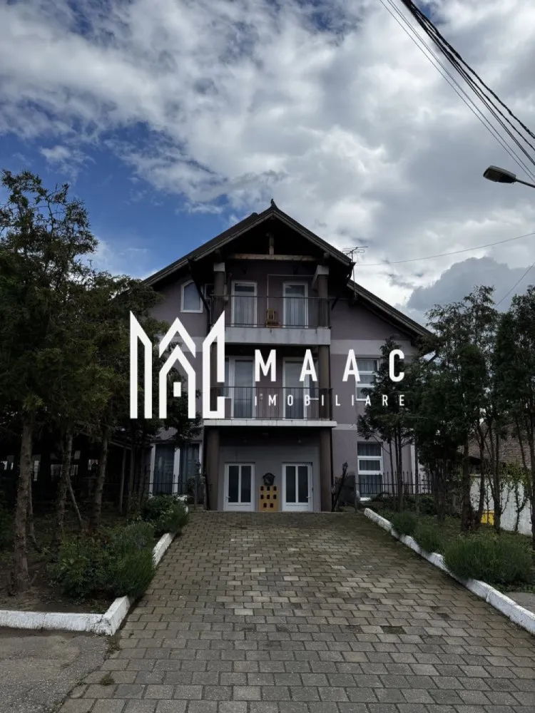 Pensiune de Vanzare | 400 MP | Zona Viile Sibiului - MAAC Imobiliare va propune spre vânzare o pensiune , într-o zonă liniștită și ușor accesibilă, ideală pentru cei care doresc o investiție sigură și profitabilă în domeniul turismului sau închirierea pe termen lung. Imobilul se află într-o zonă retrasă, dar în același timp aproape de oraș, oferind acces rapid către principalele puncte de interes și obiective turistice din Sibiu. Locația este perfectă pentru turiști, datorită liniștii și peisajului specific zonei Viile Sibiului. Pensiunea dispune de o compartimentare excelentă, gândită pentru confort și funcționalitate: • 8 dormitoare, fiecare cu baie proprie și balcon • Bucătărie complet utilată • Restaurant amenajat și funcțional • Bar • Terasă închisă, utilizabilă pe tot parcursul anului • 2 grupuri sanitare suplimentare • 4 spații de depozitare / magazii • Parcare proprie Proprietatea a fost renovată recent, fiind dotată complet și pregătită pentru preluare imediată. Se poate continua activitatea turistică actuală, preluând și conceptul de business existent. Pentru mai mute detalii sau o vizionare specificati ID:CP2804309 }}
