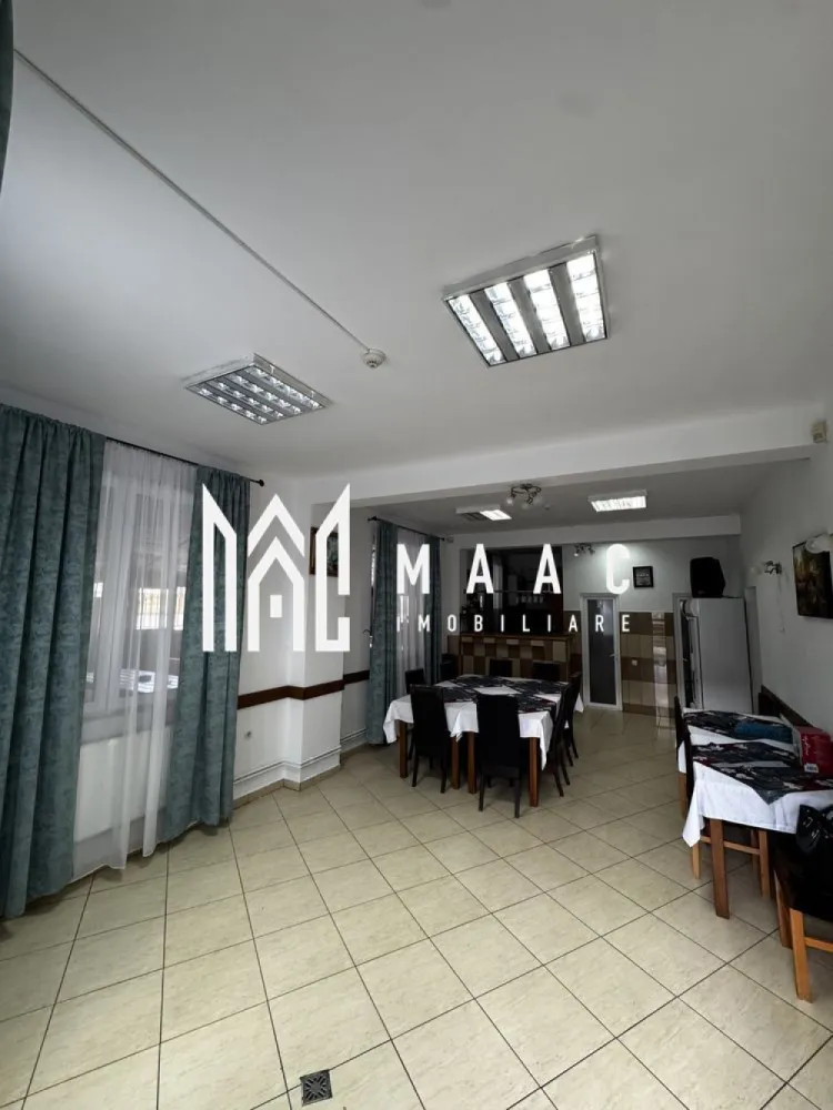 Pensiune de Vanzare | 400 MP | Zona Viile Sibiului - MAAC Imobiliare va propune spre vânzare o pensiune , într-o zonă liniștită și ușor accesibilă, ideală pentru cei care doresc o investiție sigură și profitabilă în domeniul turismului sau închirierea pe termen lung. Imobilul se află într-o zonă retrasă, dar în același timp aproape de oraș, oferind acces rapid către principalele puncte de interes și obiective turistice din Sibiu. Locația este perfectă pentru turiști, datorită liniștii și peisajului specific zonei Viile Sibiului. Pensiunea dispune de o compartimentare excelentă, gândită pentru confort și funcționalitate: • 8 dormitoare, fiecare cu baie proprie și balcon • Bucătărie complet utilată • Restaurant amenajat și funcțional • Bar • Terasă închisă, utilizabilă pe tot parcursul anului • 2 grupuri sanitare suplimentare • 4 spații de depozitare / magazii • Parcare proprie Proprietatea a fost renovată recent, fiind dotată complet și pregătită pentru preluare imediată. Se poate continua activitatea turistică actuală, preluând și conceptul de business existent. Pentru mai mute detalii sau o vizionare specificati ID:CP2804309 }}