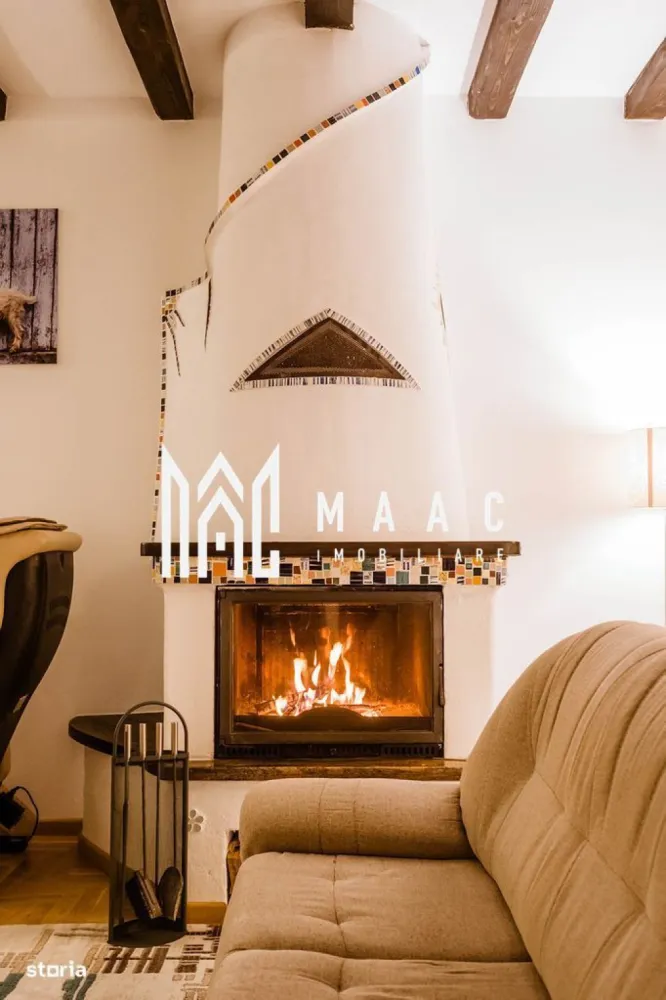 Casa 4 camere | 203 MPU | 1300 MP Teren | Tocile - MAAC Imobiliare vă propune spre vânzare o proprietate deosebită, situată la doar 15 km de Sibiu, ideală pentru cei care își doresc confort, siguranță structurală și o locație retrasă, cu vedere panoramică către Munții Făgăraș. Această casă unică, construită în anul 2015, impresionează atât prin calitatea construcției și dotările moderne, cât și prin amplasarea privilegiată, pe o stradă liniștită, ferită de agitația urbană. Informații tehnice: Suprafață desfășurată: 203 mp Structură mixtă: Parter construit din beton armat monolit – rezistență seismică ridicată Etaj din structură modulară integrală din lemn – eficiență energetică sporită Termoizolație: termosistem de 20 cm Teren: 1300 mp (cu posibilitate de extindere cu încă 550 mp) Rezistență seismică: proiectată pentru cutremure > 7,5 grade Richter Compartimentare și facilități: Zona de zi: Living cu zonă de cooking & dining adiacentă – spațiu generos, ideal pentru relaxare și socializare, cu priveliște spectaculoasă asupra Munților Făgăraș Demisol complet utilat cu: Bucătărie de vară Spălătorie Cameră tehnică Crama Zona de noapte: 3 dormitoare (inclusiv un dormitor matrimonial cu dressing propriu) 2 băi moderne Hol spațios Dotări exterioare: Filigorie amenajată complet – cuptor de pizza, grătar, încălzitor, grup sanitar și spațiu de depozitare Curte generoasă, ideală pentru relaxare, grădinărit sau amenajări suplimentare Utilități și sisteme autonome: Proprietatea beneficiază de toate utilitățile necesare unui trai modern, completate de sisteme autonome și independente, ce asigură confort, eficiență și independență energetică. Localizare: Situată într-o zonă liniștită, la aproximativ 15 km de centrul Sibiului, proprietatea oferă acces rapid la facilitățile urbane, păstrând în același timp intimitatea și liniștea unei zone rezidențiale retrase. Detalii suplimentare: Posibilitate extindere teren cu 550 mp – negociabil separat Proprietatea se vinde exact cum este prezentată, cu toate dotările existente Ideală pentru locuință permanentă, reședință de vacanță sau business turistic Pentru mai multe informații sau pentru a programa o vizionare, vă rugăm să ne contactați telefonic. Menționați ID-ul CP2614592 pentru a primi detalii suplimentare despre această proprietate unică din portofoliul nostru. }}