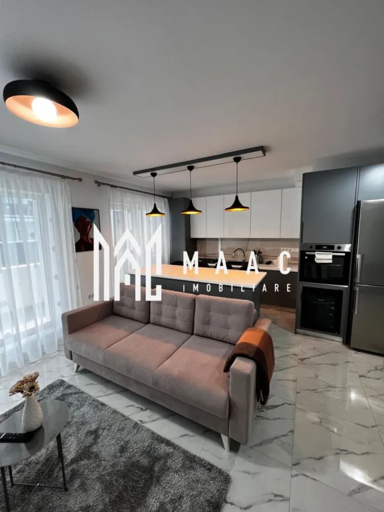 Apartament 3 camere | Terasă 12 MP | Parcare | Turnisor - MAAC Imobiliare va propune spre vanzare un apartament modern cu 3 camere, situat într-un bloc nou din Cartierul Kogălniceanu, la doar câțiva pași de centrul orașului — o locație excelentă pentru cei care își doresc confort, eleganță și acces rapid către toate punctele de interes. Cu o suprafață utilă de 71 mp, la care se adaugă o terasă generoasă de 12 mp, proprietatea impresionează prin designul contemporan, compartimentarea inteligentă și finisajele premium. Compartimentare: living spațios open-space cu bucătărie modernă și insulă 2 dormitoare luminoase 1 baie elegant amenajată terasă spațioasă de 12 mp, ideală pentru relaxare Dotări și beneficii: încălzire în pardoseală aer condiționat electrocasnice moderne de ultimă generație frigider dedicat pentru vinuri finisaje premium mobilier premium realizat la comandă se vinde complet mobilat și utilat loc de parcare inclus bloc nou Apartamentul este ideal atât pentru locuit, cât și pentru investiție, datorită poziționării excelente în una dintre cele mai apreciate zone rezidențiale, aproape de centru, restaurante, cafenele, școli și zone de promenadă. Dacă îți dorești un apartament „la cheie”, amenajat cu bun gust și atenție la fiecare detaliu, această proprietate este alegerea perfectă. Pentru mai multe detalii și programarea unei vizionări, vă rugăm să ne contactați telefonic și să menționați CP2985963. }}