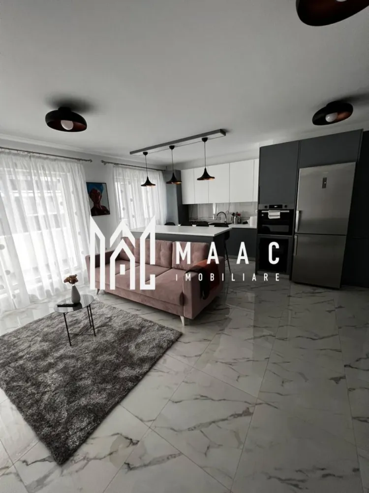 Apartament 3 camere | Terasă 12 MP | Parcare | Turnisor - MAAC Imobiliare va propune spre vanzare un apartament modern cu 3 camere, situat într-un bloc nou din Cartierul Kogălniceanu, la doar câțiva pași de centrul orașului — o locație excelentă pentru cei care își doresc confort, eleganță și acces rapid către toate punctele de interes. Cu o suprafață utilă de 71 mp, la care se adaugă o terasă generoasă de 12 mp, proprietatea impresionează prin designul contemporan, compartimentarea inteligentă și finisajele premium. Compartimentare: living spațios open-space cu bucătărie modernă și insulă 2 dormitoare luminoase 1 baie elegant amenajată terasă spațioasă de 12 mp, ideală pentru relaxare Dotări și beneficii: încălzire în pardoseală aer condiționat electrocasnice moderne de ultimă generație frigider dedicat pentru vinuri finisaje premium mobilier premium realizat la comandă se vinde complet mobilat și utilat loc de parcare inclus bloc nou Apartamentul este ideal atât pentru locuit, cât și pentru investiție, datorită poziționării excelente în una dintre cele mai apreciate zone rezidențiale, aproape de centru, restaurante, cafenele, școli și zone de promenadă. Dacă îți dorești un apartament „la cheie”, amenajat cu bun gust și atenție la fiecare detaliu, această proprietate este alegerea perfectă. Pentru mai multe detalii și programarea unei vizionări, vă rugăm să ne contactați telefonic și să menționați CP2985963. }}