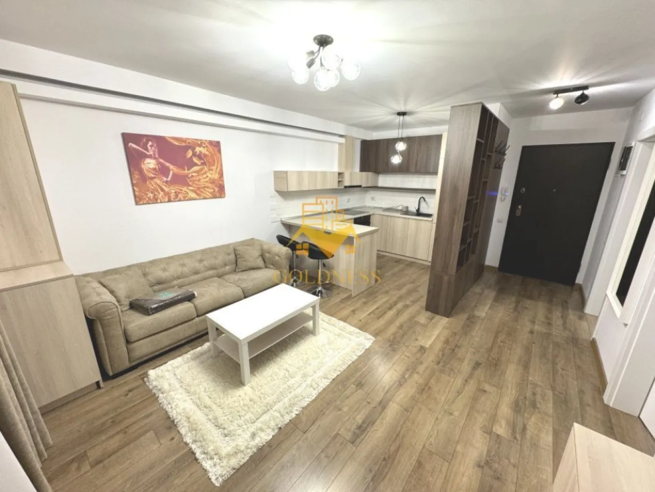 2 camere, modern, parcare, Europa Complex Luminia zona Eugen Ionesco - GOLDNESS Imobiliare vă propune spre închiriere un apartament cu 2 camere complet mobilat și utilat, la etajul 1 într-un imobil de 4 etaje, în cartierul Europa. Apartamentul este compartimentat astfel: - dormitor cu pat matrimonial, dressing, noptiere - living cu bucatarie open-space complet utilată, canapea extensibilă, loc de servit masa - baie cu cabina de dus, calorifer port prosop inox și dulap pentru depozitare. - terasa de 10 mp. Imobilul este dotat cu toate cele necesare- centrală proprie, mașină de spălat haine, frigider, plită electrică, hotă, etc. Se află în apropierea stațiilor de transport în comun, magazine, restaurante, spații verzi, farmacii, etc. Dispune de loc de parcare subterana! Dacă sunteți interesați de acest apartament și doriți să îl vizionați, dar și pentru alte oferte nu ezitați să ne contactați telefonic sau prin e-mail. Vă stăm la dispoziție! Pentru intermediere se percepe un comision de 50% din prețul chiriei! }}