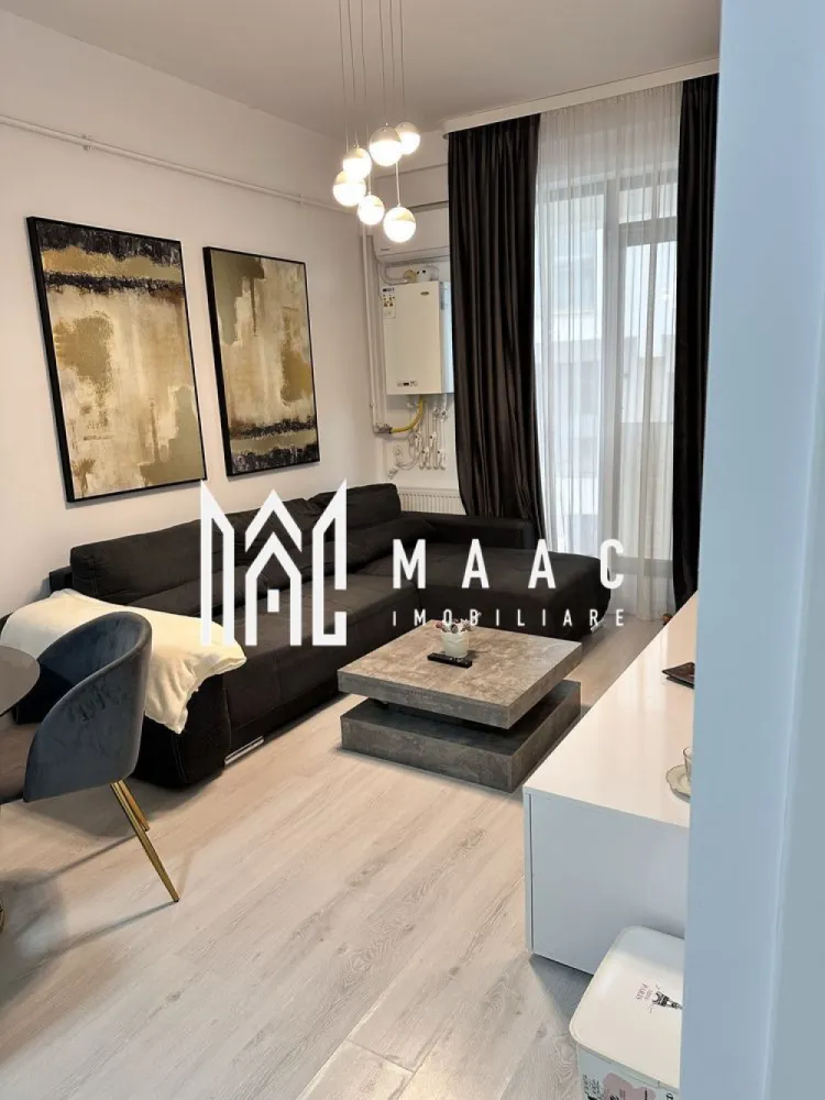 Apartament 2 camere| Finisat modern | Doamna Stanca - Maac Imobiliare propune spre vânzare un apartament cu 2 camere, situat în ansamblul Azur Residence, Doamna Stanca – o zonă în continuă dezvoltare, ideală atât pentru locuit, cât și pentru investiție. Situata la parter înalt, intr-un imobil finalizat in 2019, locuinta are o bucatarie open-space cu livingul, un dormitor, baie cu dus. Complet mobilat, modern, cu finisaje de calitate și un design interior ce aduce o nota de confort si echilibru. In pret este cuprins si un loc de parcare spațios – 30 mp, prins in CF Pentru mai multe detalii va rugam specificati telefonic ID: CP2744994 }}