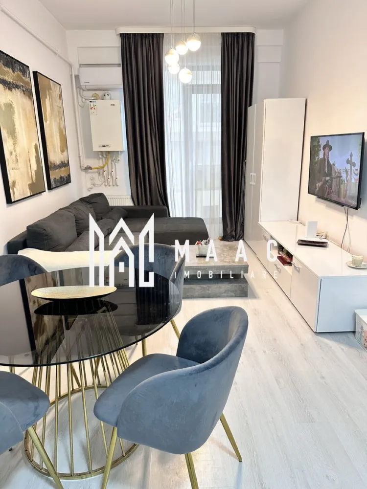 Apartament 2 camere| Finisat modern | Doamna Stanca - Maac Imobiliare propune spre vânzare un apartament cu 2 camere, situat în ansamblul Azur Residence, Doamna Stanca – o zonă în continuă dezvoltare, ideală atât pentru locuit, cât și pentru investiție. Situata la parter înalt, intr-un imobil finalizat in 2019, locuinta are o bucatarie open-space cu livingul, un dormitor, baie cu dus. Complet mobilat, modern, cu finisaje de calitate și un design interior ce aduce o nota de confort si echilibru. In pret este cuprins si un loc de parcare spațios – 30 mp, prins in CF Pentru mai multe detalii va rugam specificati telefonic ID: CP2744994 }}
