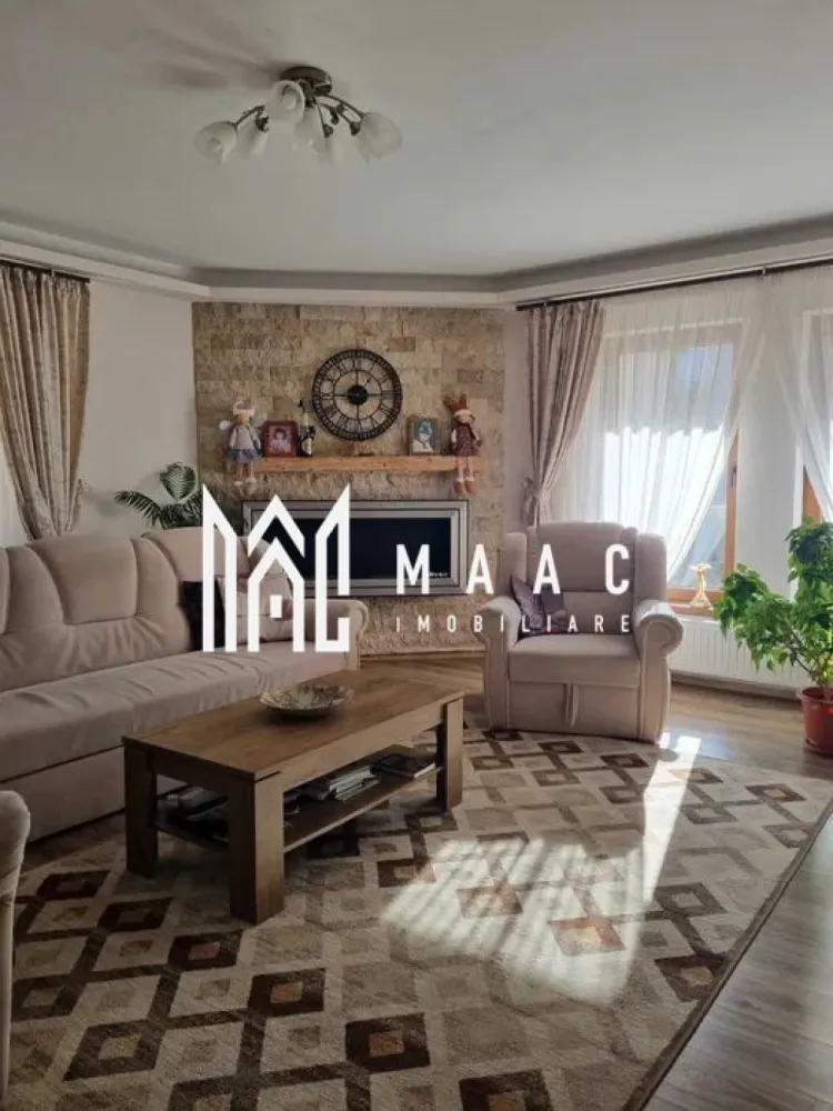Casa 5 camere | 160mp | Terasa | Pod | Pivnita | Balcon | Semineu | Sura Mica - MAAC Imobiliare vă propune spre vânzare o casă individuală, cu o suprafață utilă de 160 mp, ideală pentru cei care își doresc confort, spațiu și intimitate.

Locuinta are o suprafata utila de 160 mp, fara balcoane, pivnita si terase fiind structurata astfel:
 
pivniță cu suprafata de 24 mpu;
terasa cu suprafata de 24mpu;

- parter - living generos cu semineu pe bioetanol,
- bucatarie separata complet utilata cu masina de spalat vase, plita prin inducție si cuptor incorporat si dining cu iesire pe terasa,
- camara cu geam de aerisire,
- baie cu cabina de dus si geam de aerisire,
- dormitor/birou,
- hol generos cu acces la etaj,
- casa scarii o o scara interioara din beton imbracata in lemn masiv,
- terasa inchisa.

- etaj - trei dormitoare generoase,
- un dresing,
- o baie cu cada si geam de aerisire,
- doua balcoane cu acces din toate dormitoarele,

- pod inalt cu suprafata de 80 mp termoizolat si cu geamuri mari, ideal pentru amenajare spatiu de locuit sau depozitare.

Imobilul este izolat termic, beneficiaza de incalzire centrala proprie pe gaz cu calorifere, aer condiționat și tamplarie PVC.

Terenul are o suprafata totala de 513 mp cu o deschidere de 16,1 metri la stradă.
In curtea din față sunt amenajate doua locuri de parcare si gradina cu plante ornamentale.
Curtea din spatele casei este amenajata cu gazon, un balansoar, o magazie de depozitare, gradina de legume si pomi fructiferi pe rod.

Pentru mai multe detalii sau programarea unei vizionări, nu ezitați să ne contactați specificand ID: CP3061682