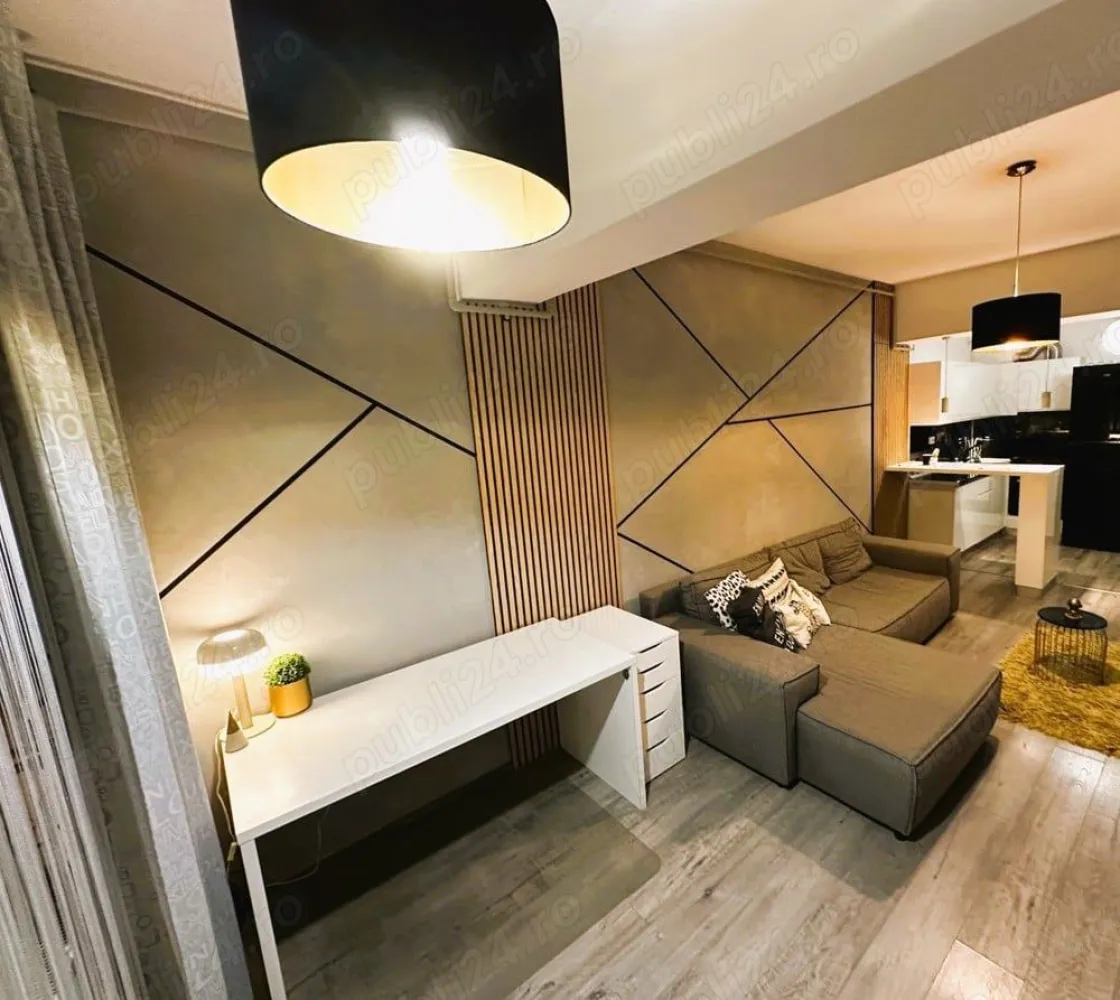 Direct Proprietar inchiriere ap 2 cam rond Alba Iulia unirii Bucuresti - Direct Proprietar inchiriere apartament 2 camere superb Unirii rond Alba Iulia Bucuresti Direct Proprietar ofer spre inchiriere un superb apartament de 2 camere complet utilat si mobilat modern in zona Bulevardului Unirii Bucuresti, rond Alba Iulia. Apartamentul este situat in spatele Bulevardului Unirii nr 80,(30 metri) intr-un bloc nou securizat cu 2 lifturi, construit in 2018 la etajul 5 din 7. Apartamentul are o suprafata utila de 58 metri patrati si dispune de spatii de depozitare generoase(dressing hol, dressing pe tot peretele in dormitor si un balcon deschis de 5 mp care ofera o priveliste frumoasa libera spre blocurile din Bulevardul Unirii. Apartamentul dispune si de o canapea mare extensibila in living, zona de birou si plasma smart TV cu internet de mare viteza. Apartamentul dispune de centrala proprie si de aer conditionat iar bucataria este de tip open-space cu masa si scaune bar. Mentionez ca pozitia apartamentului este una foarte buna, blocul foarte bine izolat astfel incat facturile de intretinere sunt foarte mici si iarna. Ca si pozitionare este la cativa pasi de toate restaurantele din zona rond piata Alba Iulia si Bulevardul Unirii sau Decebal (Restaurant Amoon Unirii, Arogant Resturant&Lounge etc) si supermarketuri precum Mega image, Penny la cativa metri de mers pe jos. De asemenea se poate iesi foarte usor si in Calea Dudesti ajungand imediat in parcarea din spatele Bucuresti MALL (Mall Vitan) astfel incat se poate ajunge la mall in 3 minute de mers pe jos. Statiile de autobuz sau tramvai sunt la 1 minut distanta iar statia de metrou se afla la 10 minute de mers pe jos sau pana la Piata Unirii se poate ajunge intr-o frumoasa plimbare la pas de 20 minute (cu masina 5 minute). Pentru mai multe detalii si informatii .Va asteptam cu drag la vizionare!