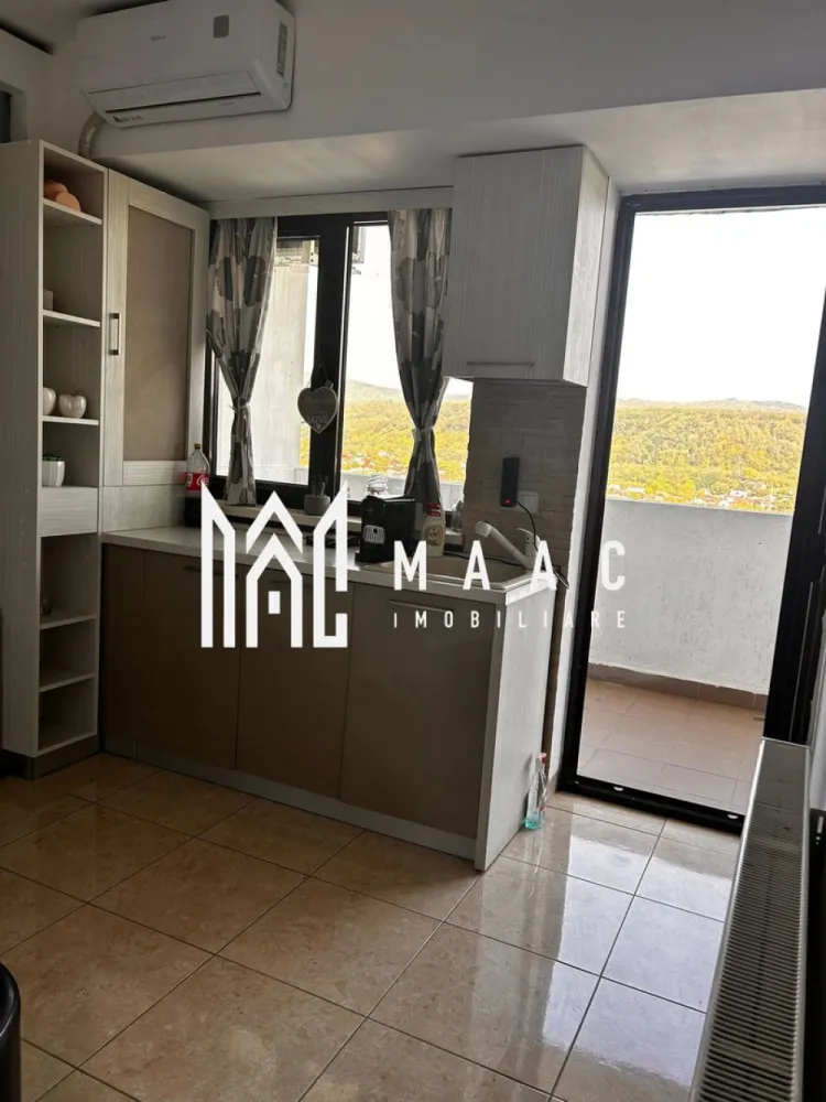 Apartament 4 Camere I Terasă 10.5 mp I Bloc nou I Ramnicu Valcea - Apartament 4 camere în bloc nou – spațiu generos și vedere deosebită în Râmnicu Vâlcea MAAC Imobiliare vă propune spre vânzare un apartament cu adevărat special, situat într-un bloc nou, la etajul 14 din 15, perfect pentru cei care caută confort, lumină naturală și priveliști impresionante. Ce îți oferă acest apartament? 66 mp utili, cu un concept inteligent: living și bucătărie open space de 30 mp, ideal pentru momente relaxante sau întâlniri cu cei dragi. 3 dormitoare spațioase (13, 12 și 7 mp), potrivite pentru odihnă și intimitate. Baie modernă Terasă de 10,5 mp, unde te poți bucura de aer curat și panorame superbe asupra orașului și râului Olt. Apartamentul este renovat, cu bucătărie delimitată și dotat cu aer condiționat pentru un plus de confort. De ce să alegi această proprietate? Bloc construit în 2015, cu spații comune moderne și bine întreținute. Două lifturi rapide pentru acces facil, chiar și în orele aglomerate. Locație excelentă, aproape de magazine, școli și mijloace de transport, cu acces rapid în toate zonele orașului. Aceasta este șansa ta să locuiești într-un apartament modern, într-o zonă dinamică, cu toate facilitățile la îndemână. Pentru detalii suplimentare, consultanță sau programarea unei vizionări, va rugăm să ne contactati specificand ID: CP2779924. }}