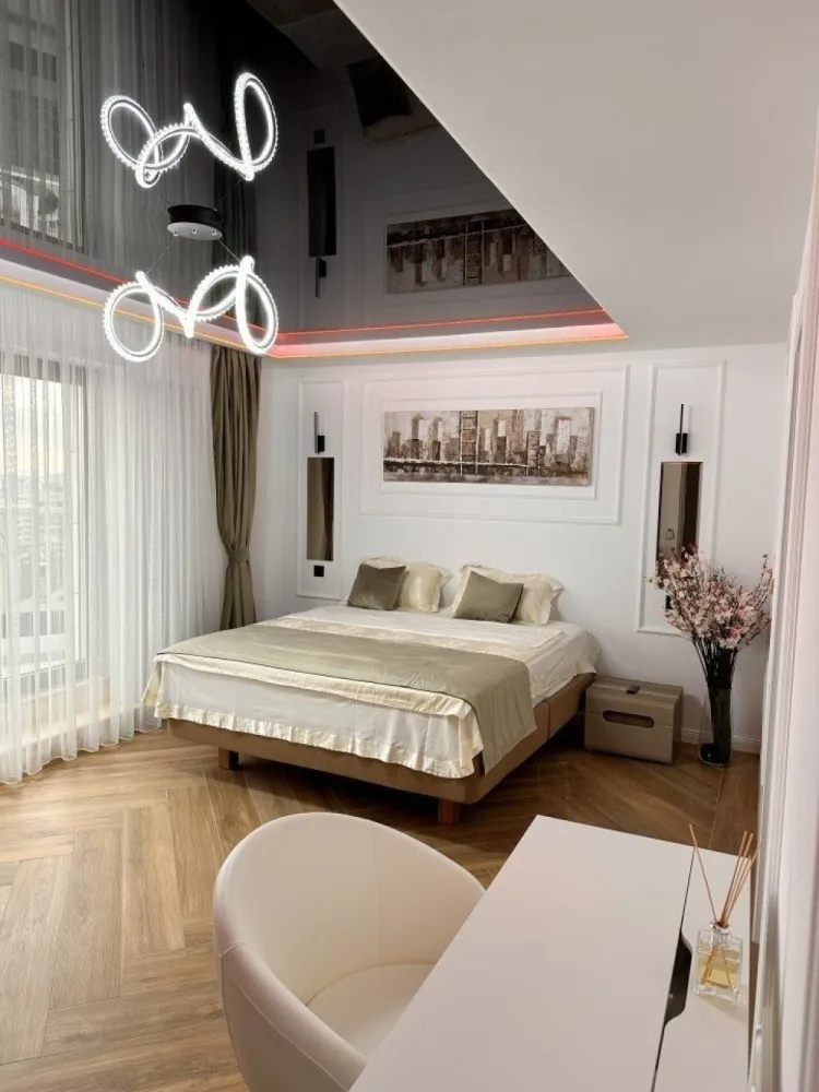 Penthouse exclusivist, 650 mp, Unirii-Alba Iulia-Mall Vitan CRYPTO Accept - Descoperiti Eleganta Suprema in Inima Bucurestiului! Va invitam sa va indragostiti de rafinamentul si luxul definitiv in acest penthouse extraordinar, situat intr-o locatie unica in zona Unirii-Alba Iulia-Mall Vitan. Cu o suprafata generoasa mde 210 metri patrati utili, acesta reprezinta o bijuterie imobiliara care imbina opulenta cu eleganta intr-un mod desavarsit gandita si creata de un designer italian (Michele Drill). Caracteristicile deosebite includ nu doar dimensiunile impresionante, ci si terasele sale magice, totalizand 450 metri patrati, oferind privelisti panoramice ale intregului Bucuresti. Admirati Palatul Parlamentului, Catedrala Mantuirii Neamului, Mall Vitan si Zona Unirii si Mihai Bravu in toata splendoarea lor. Aceasta locuinta exceptionala este complet mobilata si utilata, gata pentru a va primi imediat, doar cu hainele. De la masina de spalat rufe si vase, fier de calcat, frigider, aparat de cafea, fierbator, pana la TV cu ambilight, pat cu masaj si "0 gravity", leduri ambientale dinamice pe terasa, bucatarie de vara si mobilier Chesterfield - fiecare detaliu a fost ales cu grija pentru a va oferi o experienta de viata fara cusur. Cele trei dormitoare si baile elegante cu oglinzi bronz cu leduri completeaza aceasta oaza de confort si rafinament. Baile sunt dotate cu sanitare Grohe, Villeroy & Boch. Bucataria spatioasa open space si insula, cu cele mai noi echipamente (gratar pe gaz cu 3 zone de gatire, plita inductie, cuptor microunde, cuptor normal electric incorporabile, aparat cafea Nespresso, prajitor paine 2x2, fierbator) devine centru de creatie culinara, iar livingul cu design sofisticat si vedere panoramica va asteapta pentru momente relaxante alaturi de cei dragi. Acest penthouse de exceptie este pregatit sa devina locuinta in care visele prind viata. Descoperiti fiecare secret al acestei proprietati unice si transformati-o in caminul dvs. exclusivist. Acceptam plata cu criptomonede, aducand un element modern si inovator in aceasta experienta de cumparare. Pentru mai multe informatii sau pentru a programa o vizionare, va stam la dispozitie. Accept plata in Crypto.